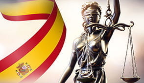 The Spain flag and justice statue.