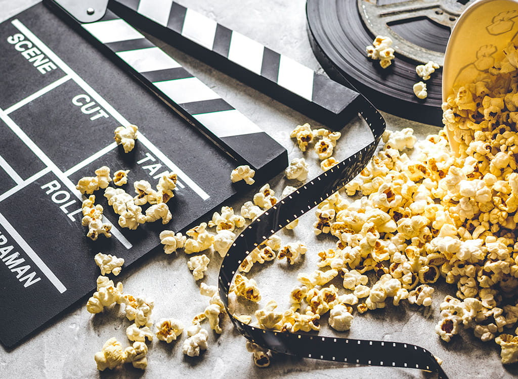 A Movie Clapperboard and Popcorn