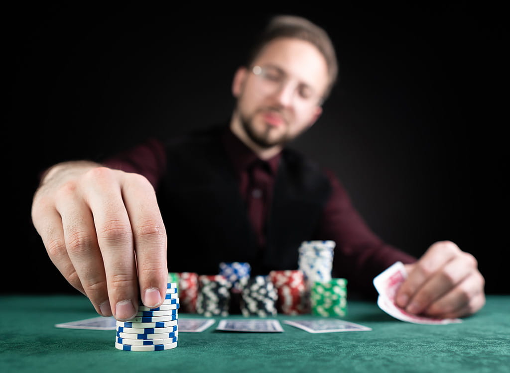 A Person Playing Poker at A Casino