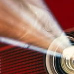 A Movie Projector On A Red Background