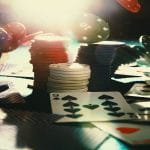 A Poker Table with Piles of Poker Chips On It