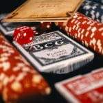 A Table with Card Decks and Poker Chips on It