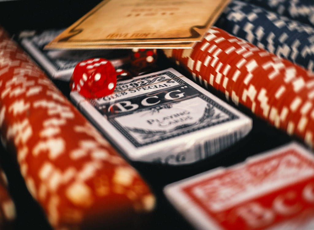 A Table with Card Decks and Poker Chips on It 