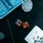 Poker Chips, Cards, and Dice on A Table