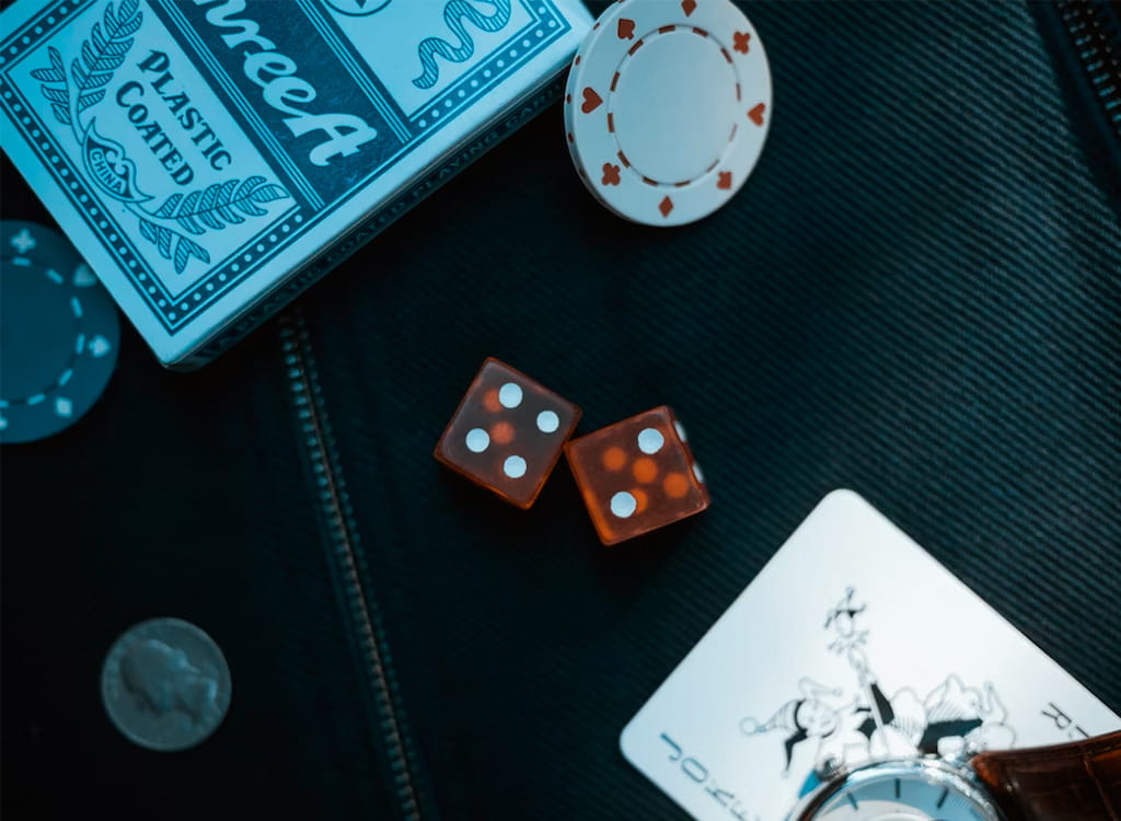 Poker Chips, Cards, and Dice on A Table 