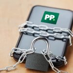 Paddy Power mobile app locked with chains and padlock, symbolizing data breach and account security concerns